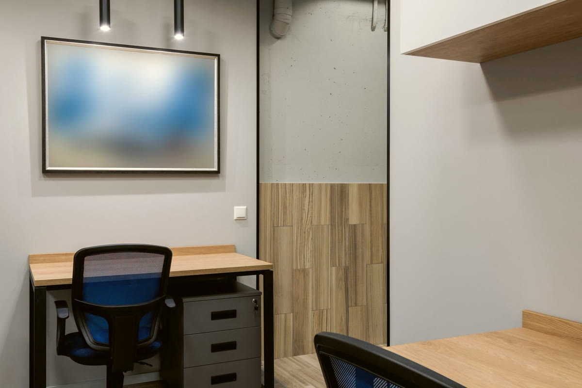 Clean empty desks in a modern office ready for the workday